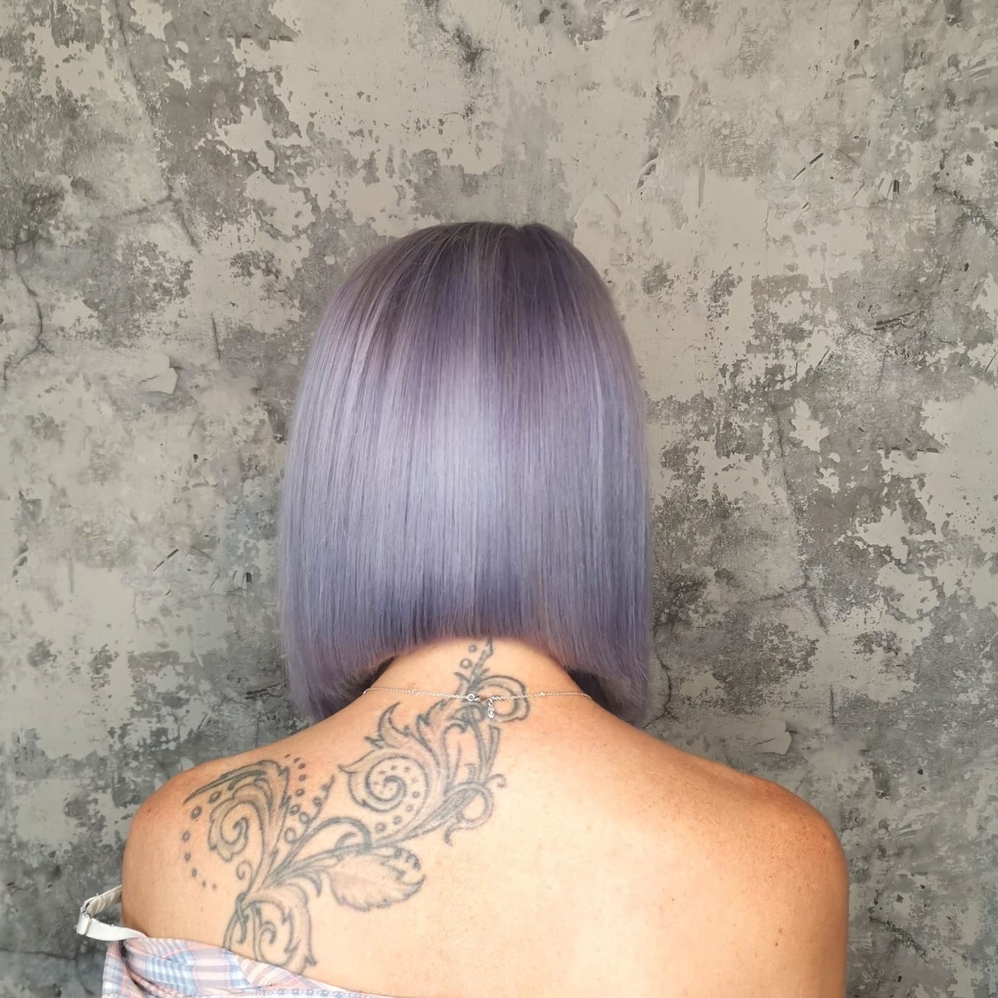 A smooth lilac bob with a clean curved shape